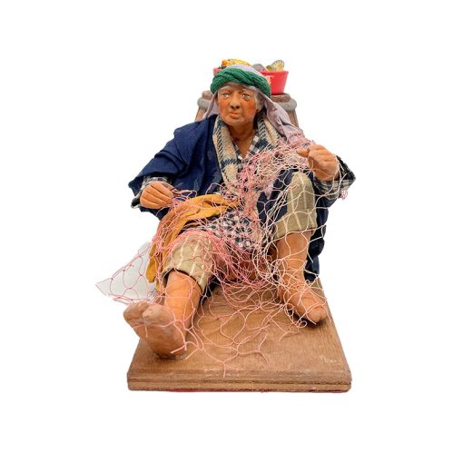 Pescador cosiendo red 24 cm, figura móvil para belén